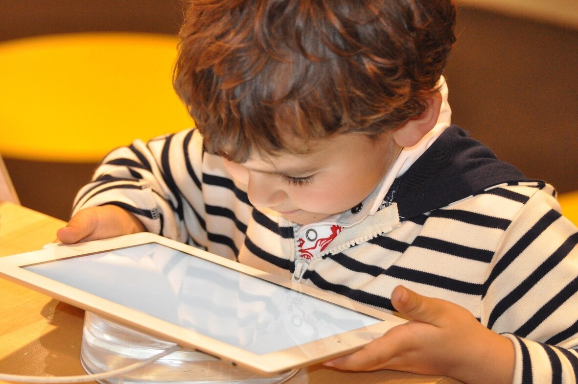 child on tablet, young child screen time, learning how to reduce screen time for child